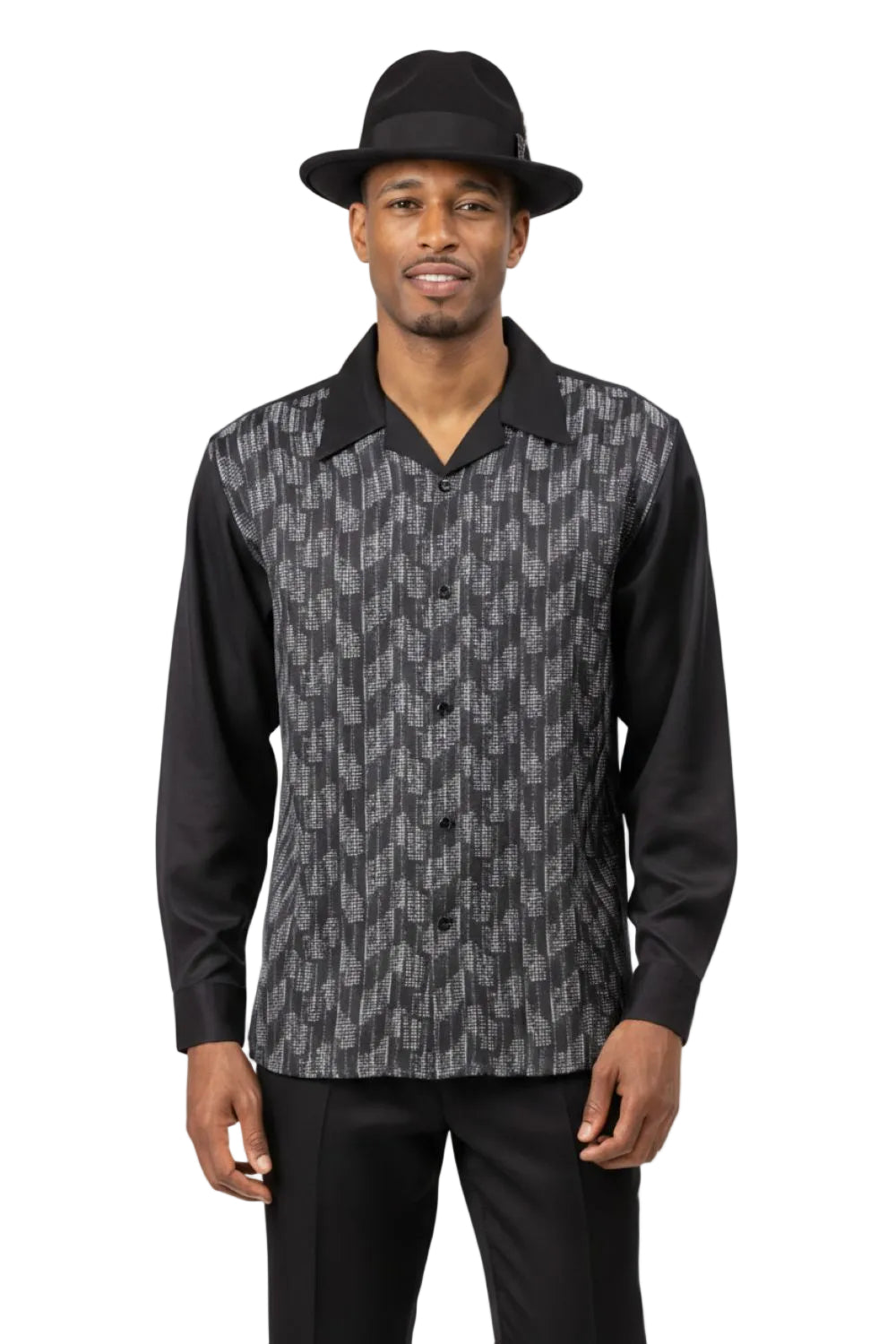 Man wearing a patterned shirt with a black collar and black hat on a white background