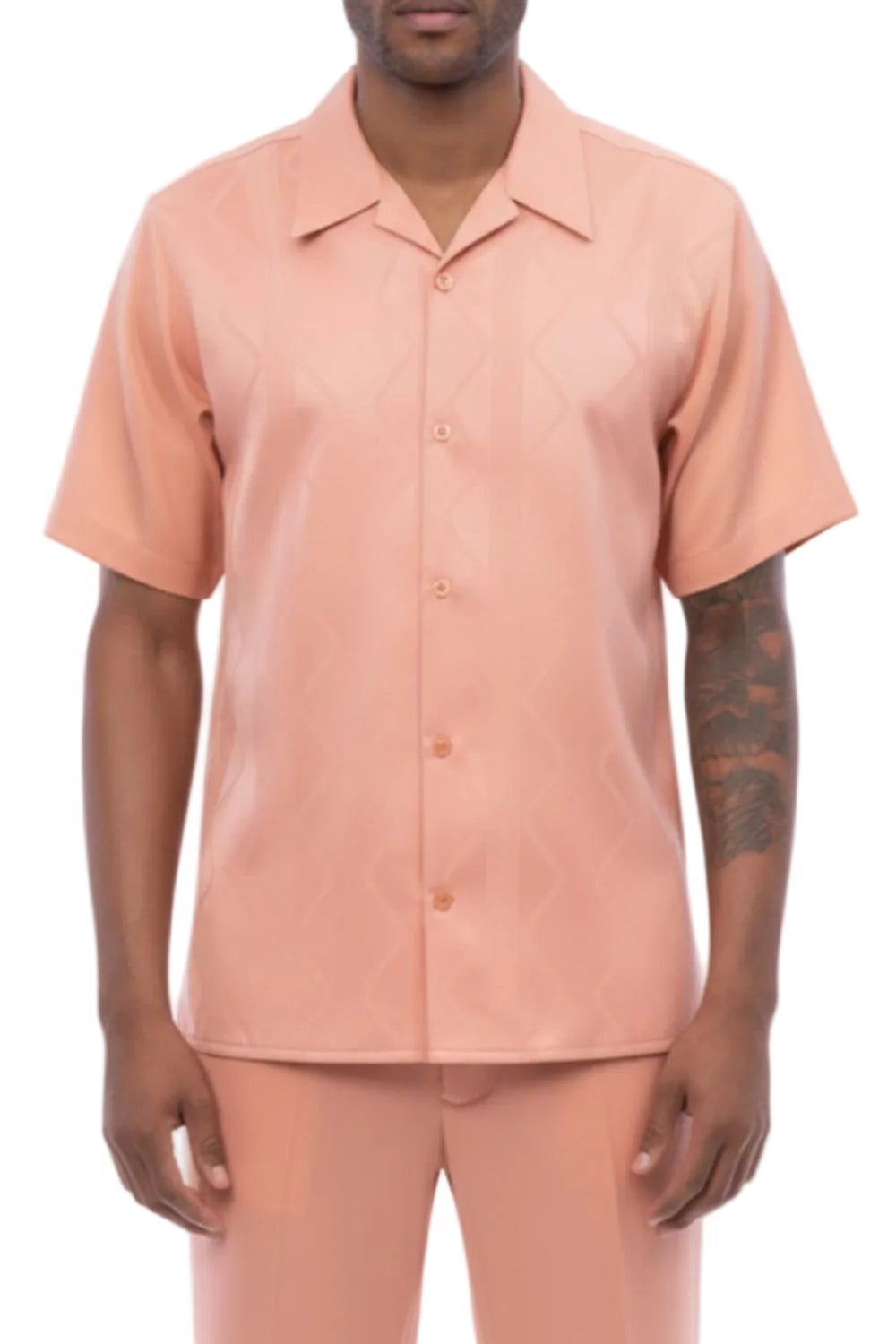 Man wearing a peach-colored shirt and pants on a white background