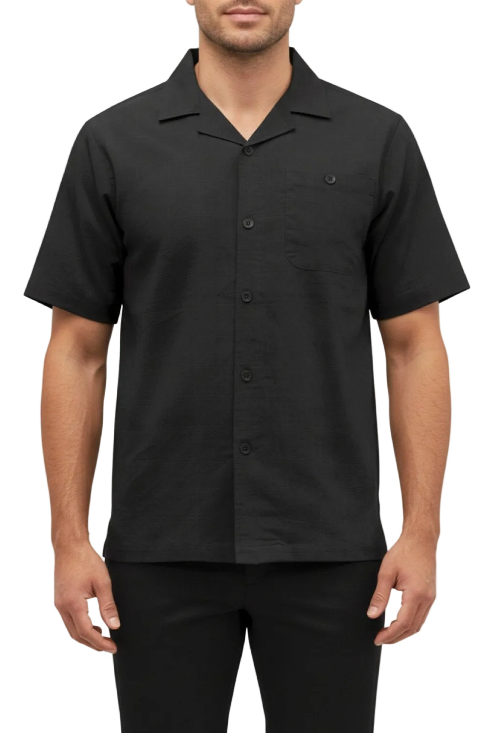 Man wearing a black short-sleeve button-up shirt on a white background