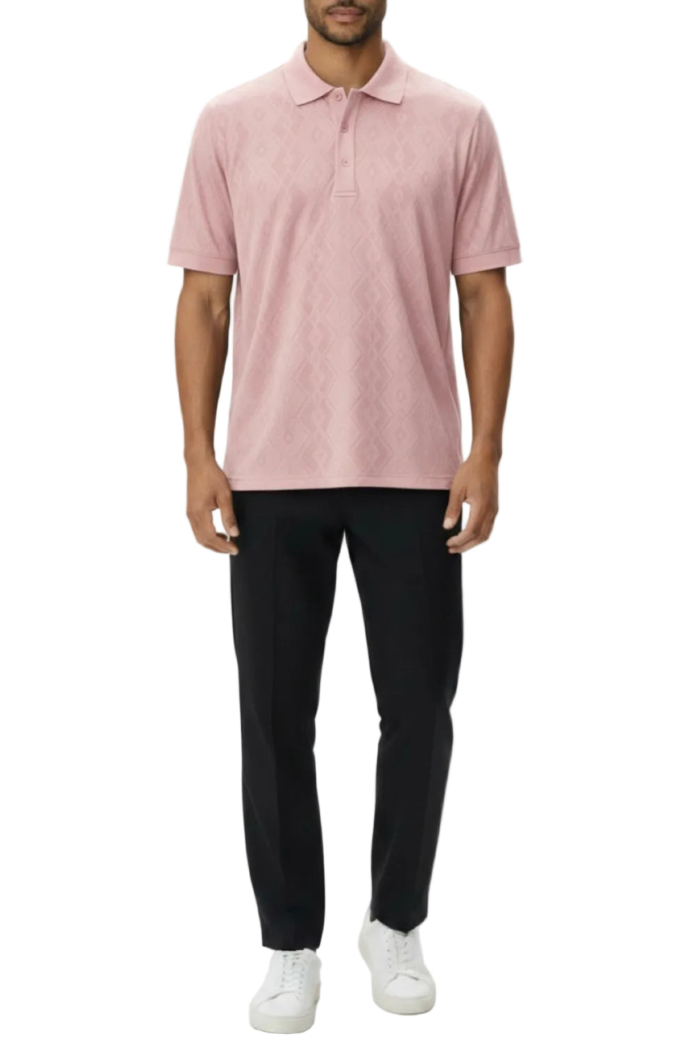 Person wearing a pink polo shirt, black pants, and white shoes on a white background