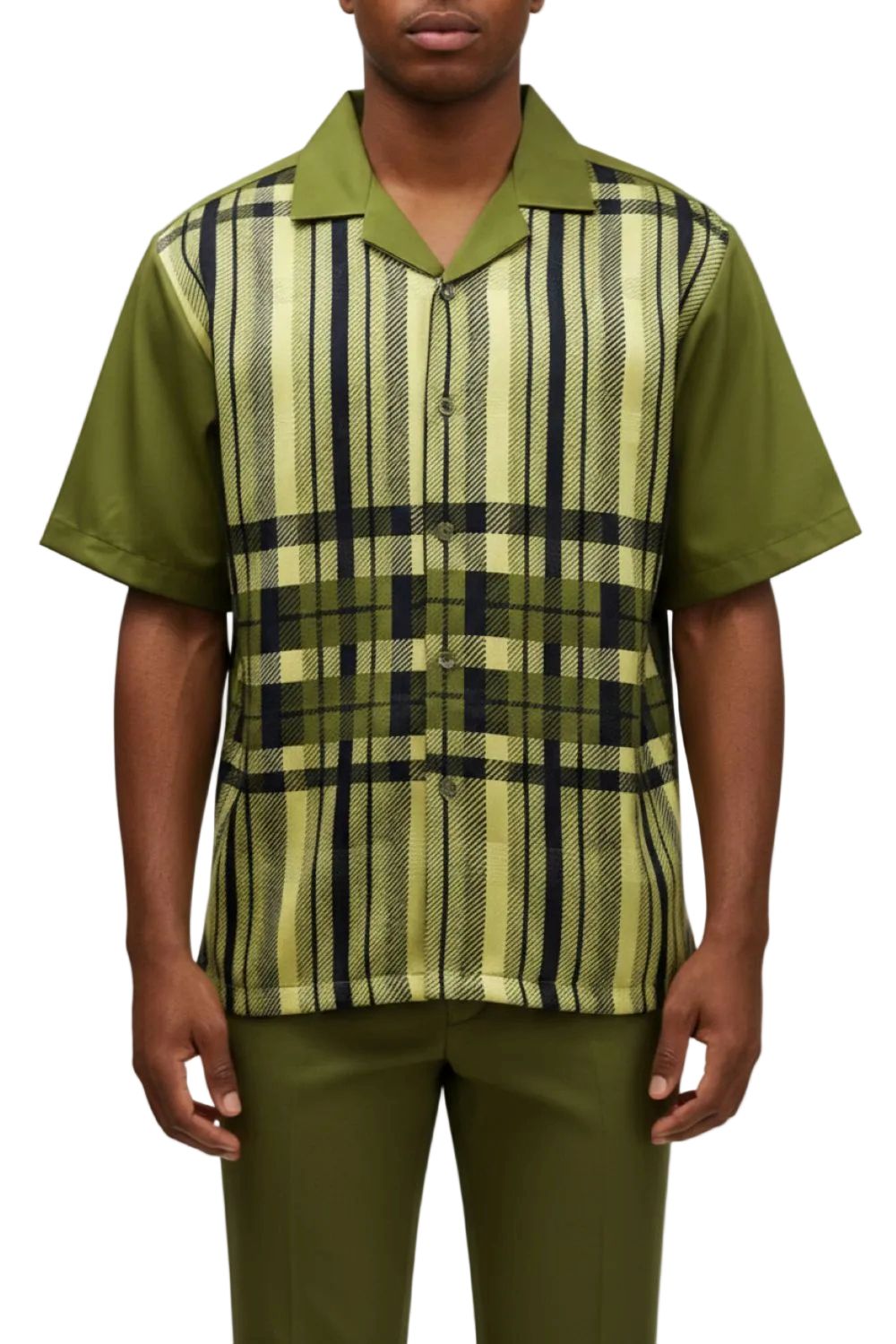 Person wearing a green and black checkered shirt with a plain background