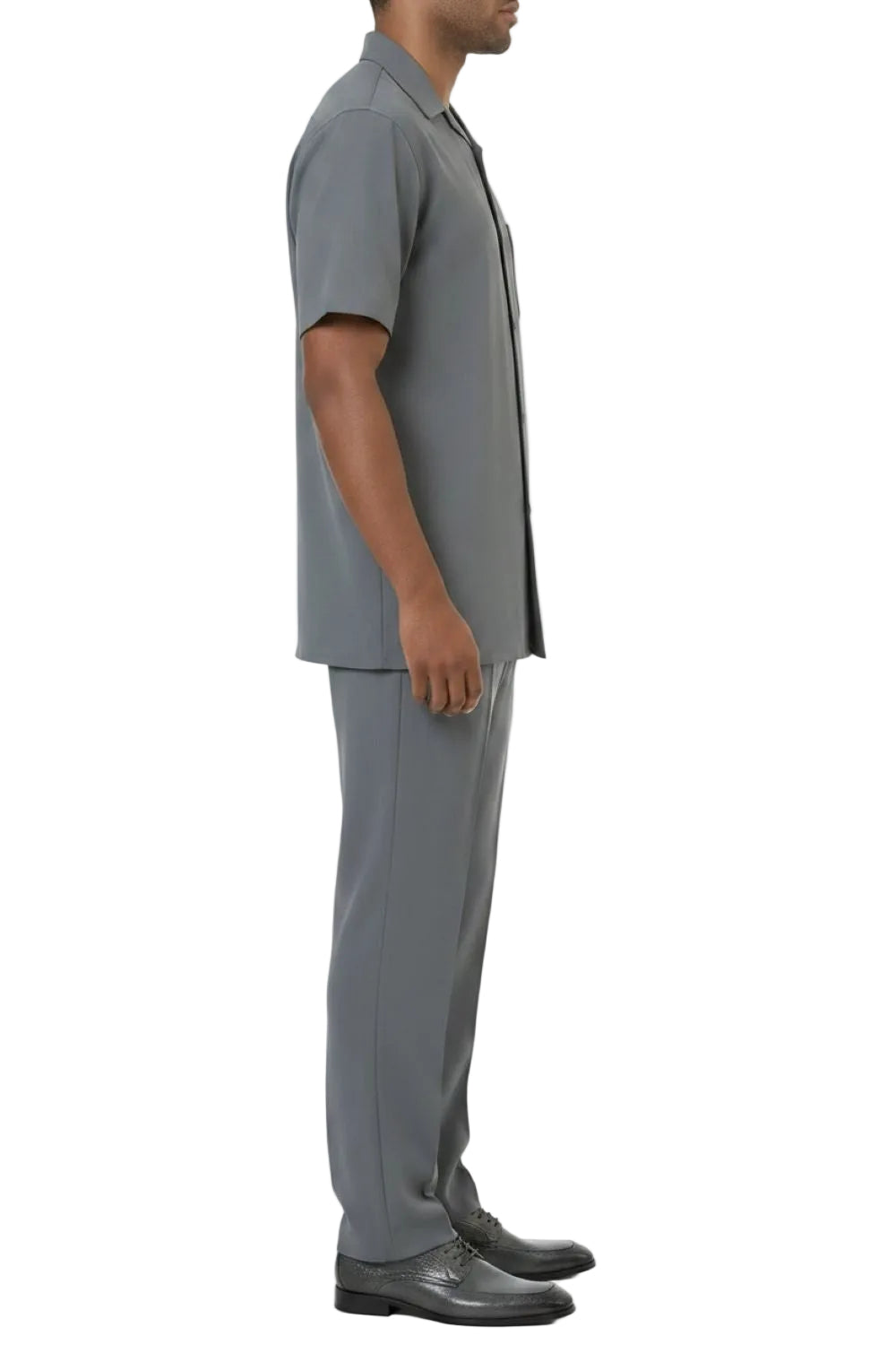 Man wearing a gray outfit with a shirt and pants on a white background
