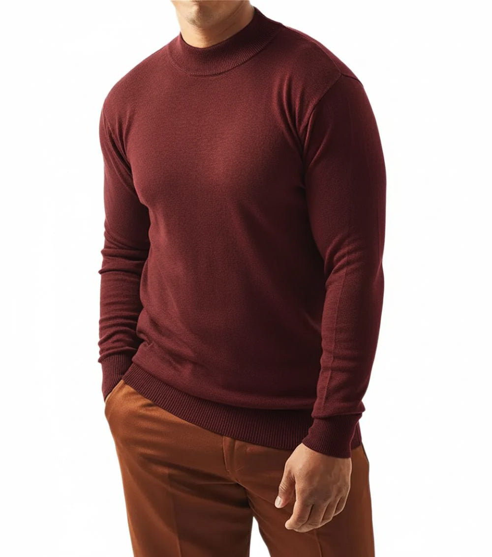 Man wearing a maroon sweater and brown pants on a white background