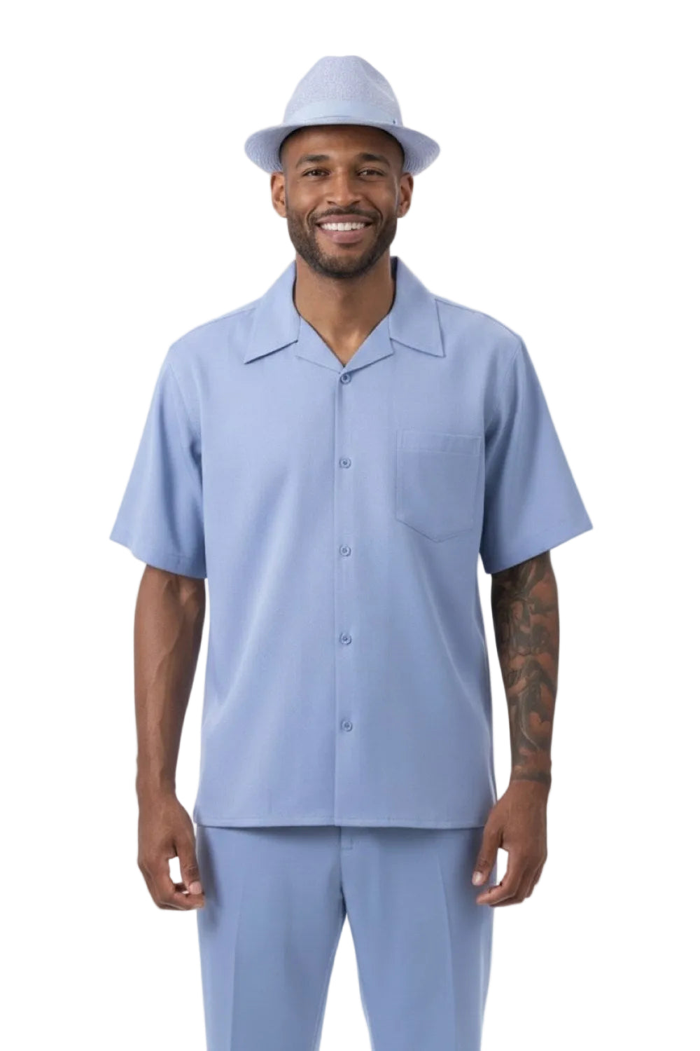 Man wearing a carolina blue shirt and pants with a matching hat on a white background