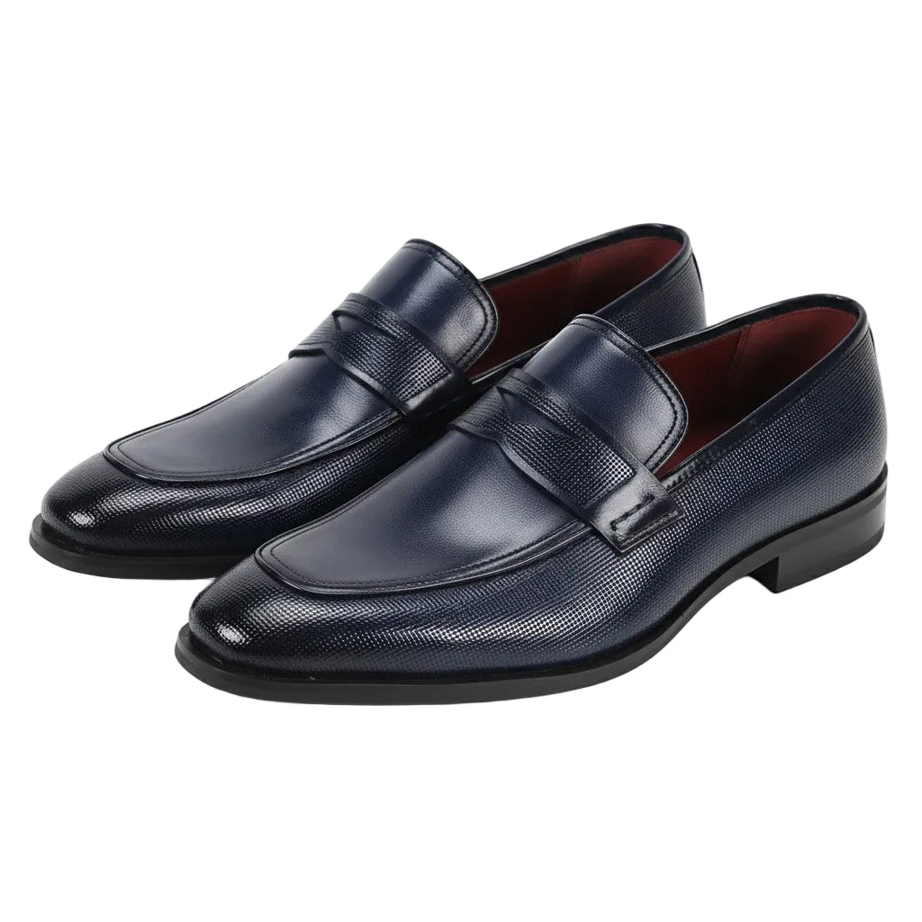 Pair of navy blue leather loafers on a white background