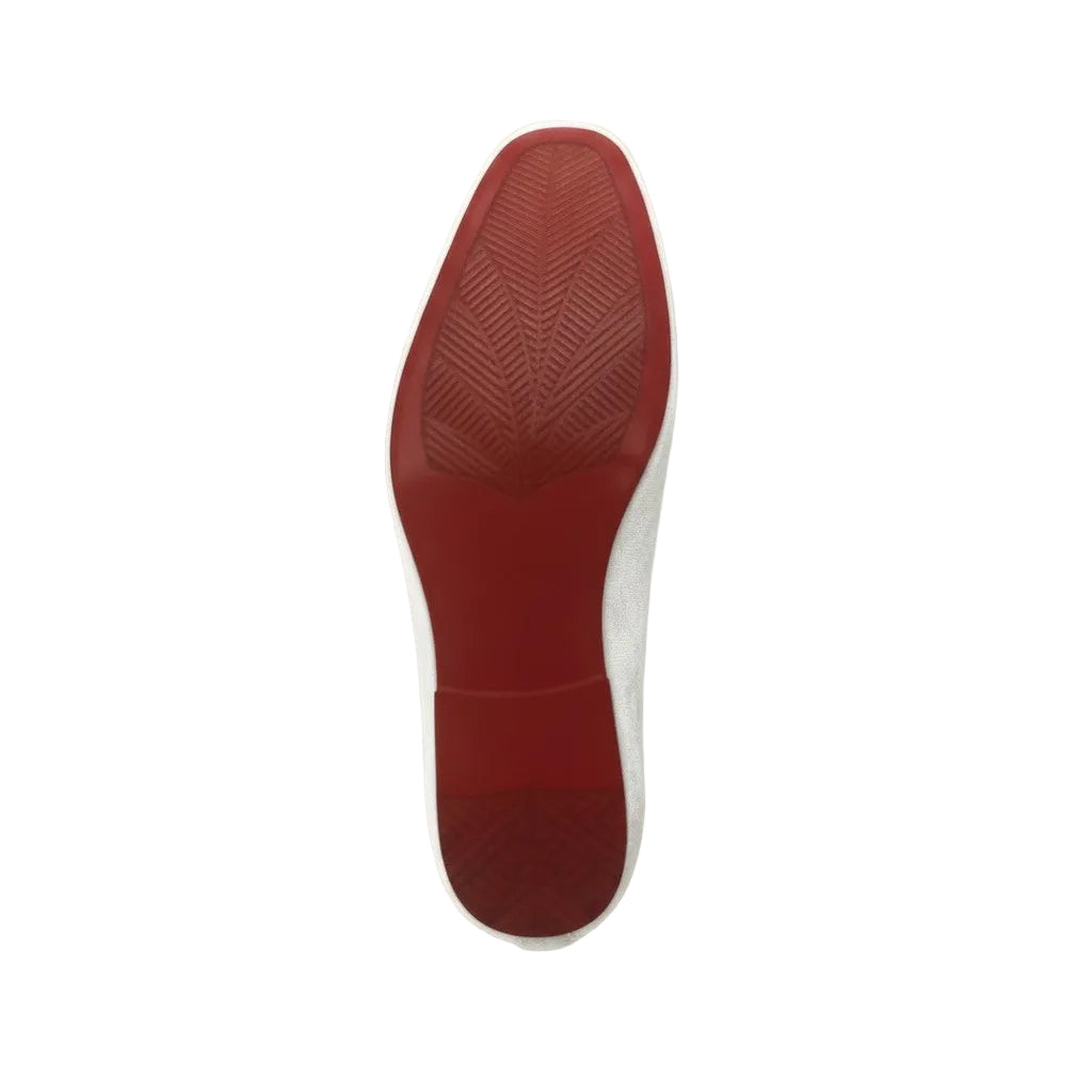 Red sole of a shoe on a white background