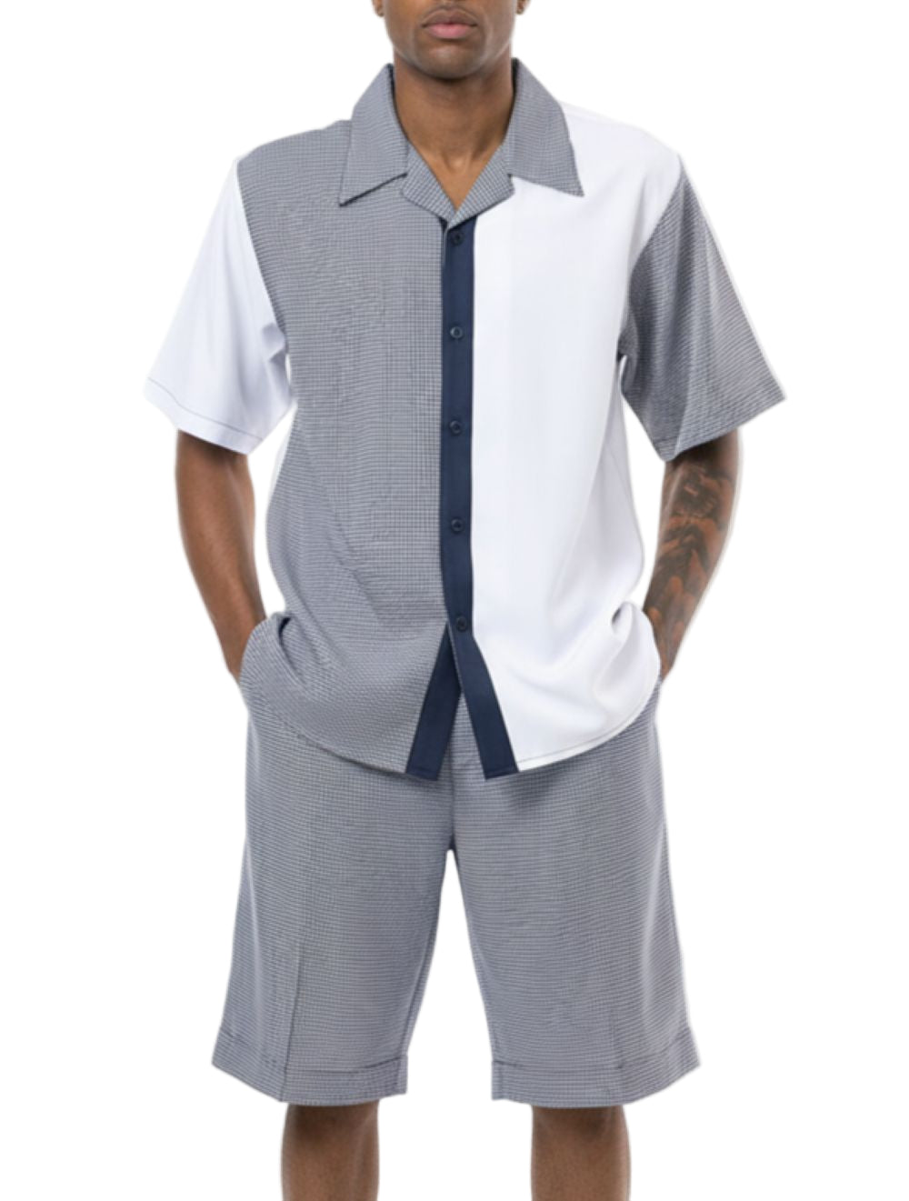 Man wearing a gray and white patterned shirt with matching shorts on a white background