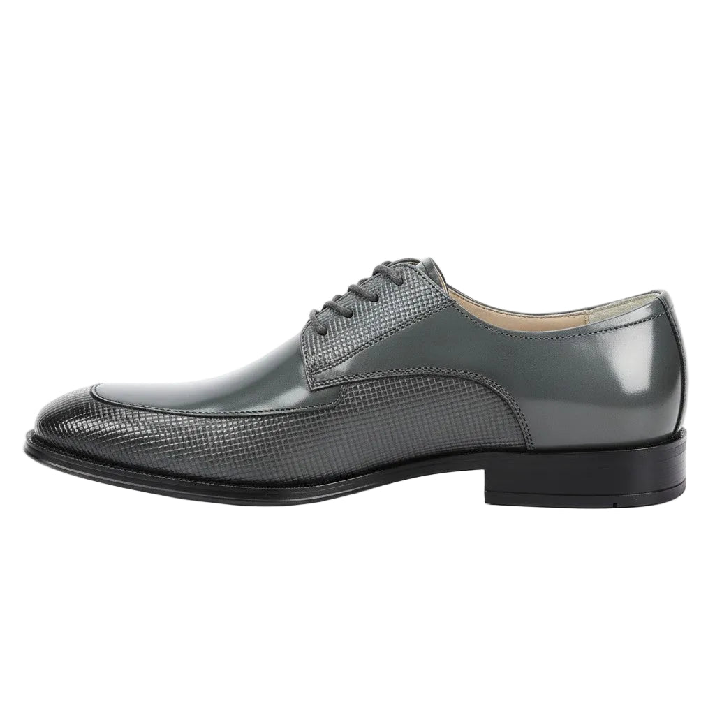 Gray dress shoe with black sole on a white background