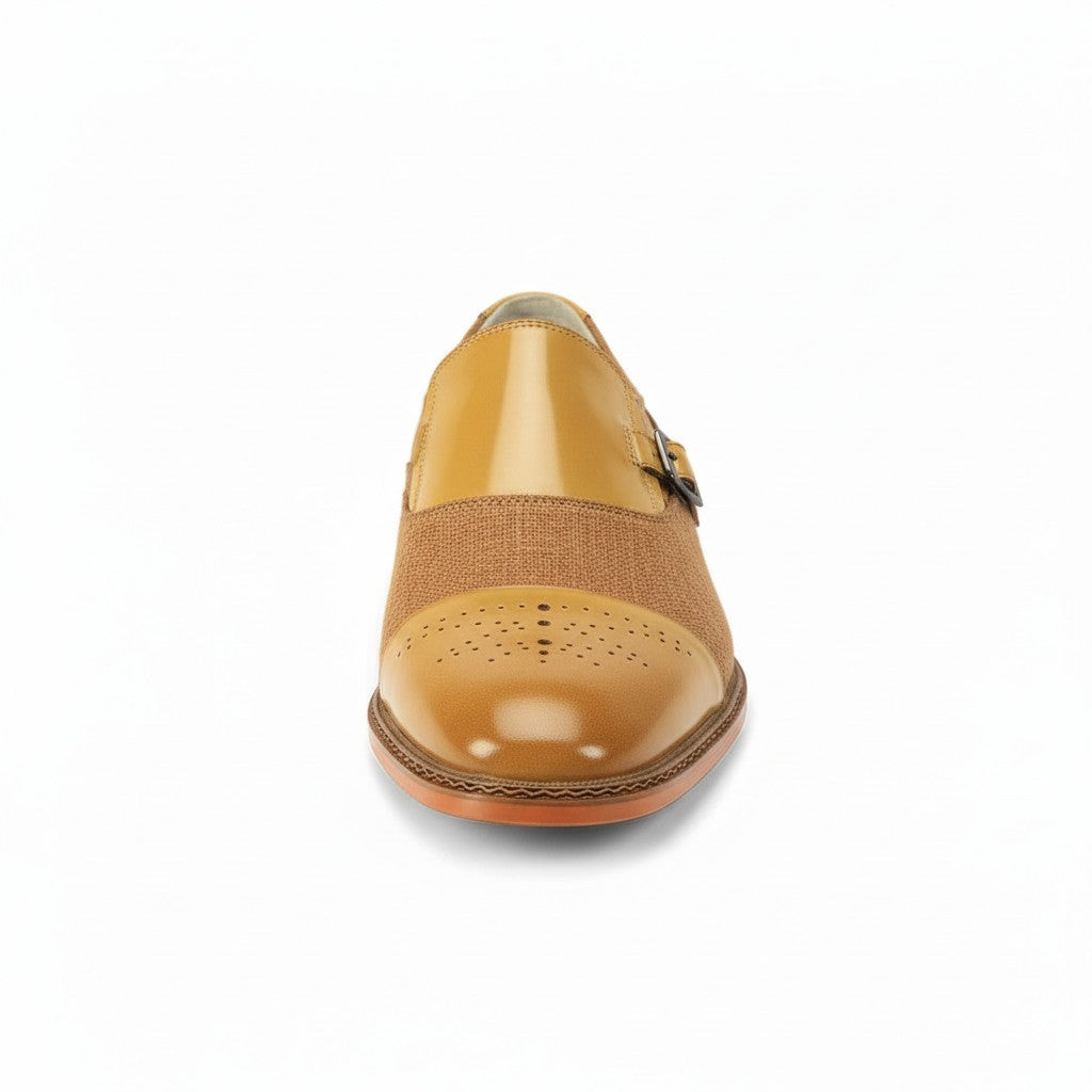 Scotch tan leather shoe with a buckle on a white background