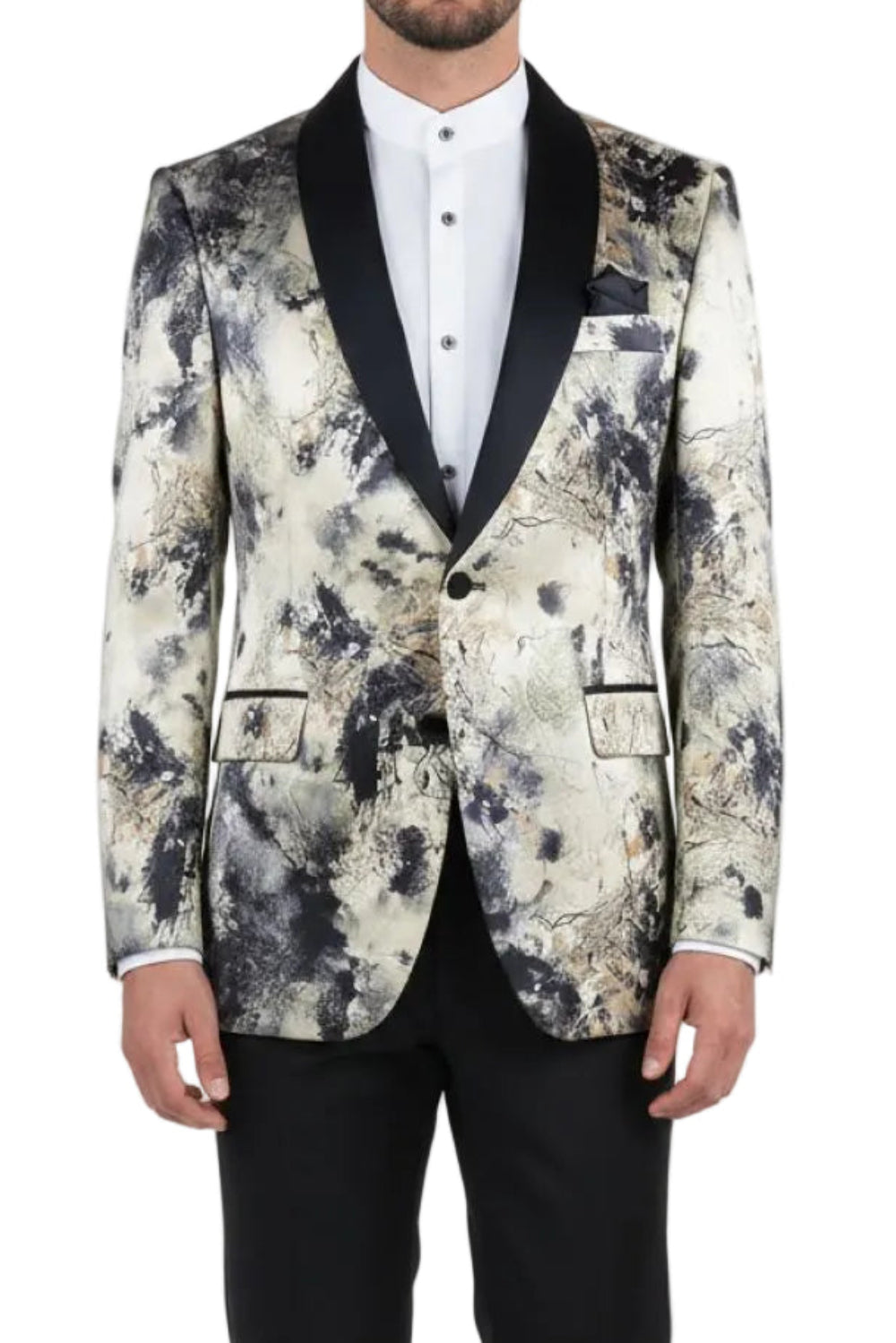 Man wearing a floral-patterned blazer with black lapels and black pants on a white background