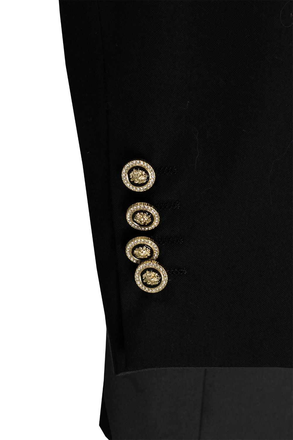 Close-up of a black blazer with gold buttons on a white background