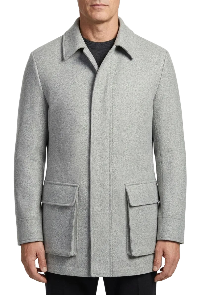 A man wearing a light gray wool-blend coat with a collar, front button closure, and two large flap pockets on a plain light gray background.