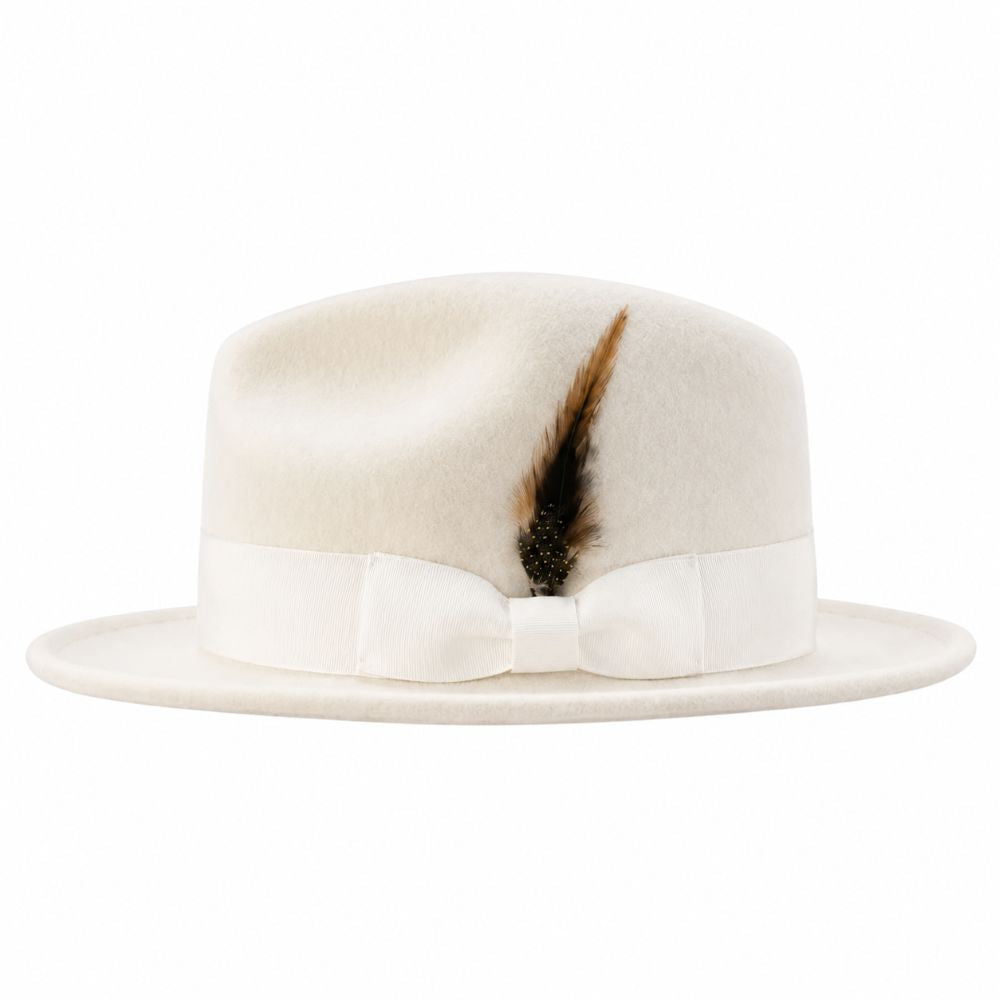 An off-white felt fedora hat featuring a matching white satin bow and band, accented with a brown and black feather on the front, set against a plain white background.