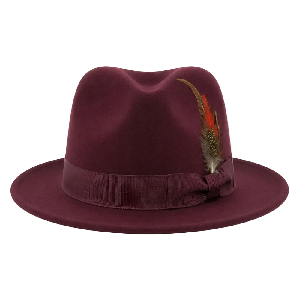 A dark burgundy felt fedora hat with a matching ribbon band and bow, decorated with a brown and orange feather, shown against a plain white background.