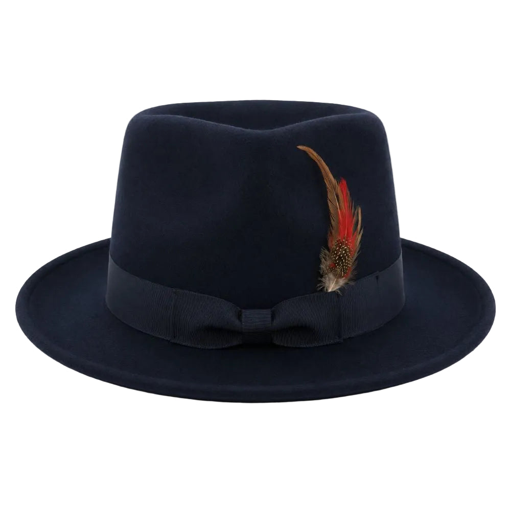 A navy blue felt fedora hat with a matching navy blue ribbon band and bow, decorated with a red and brown feather on the side, set against a plain white background.