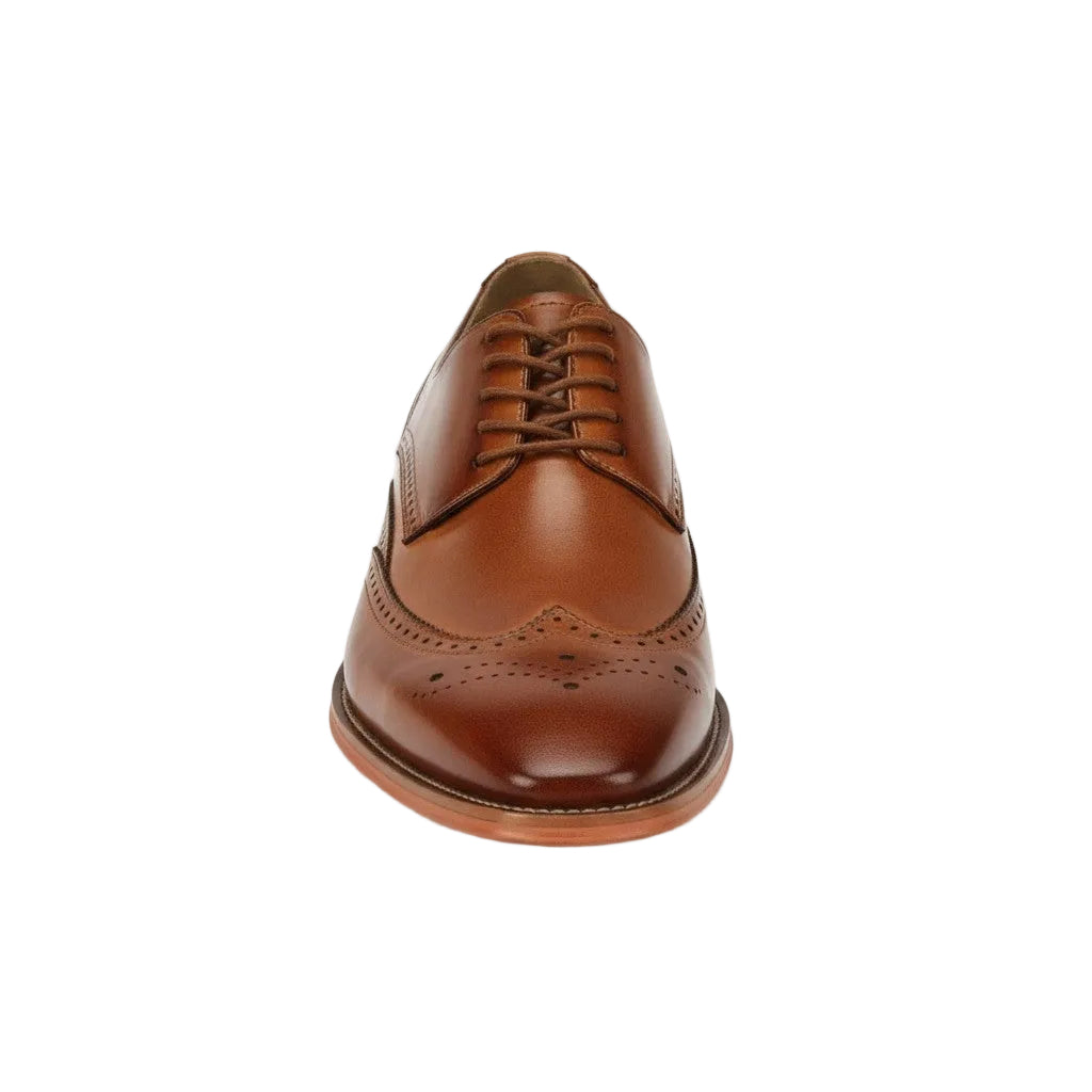 Tan leather brogue shoe on a white background