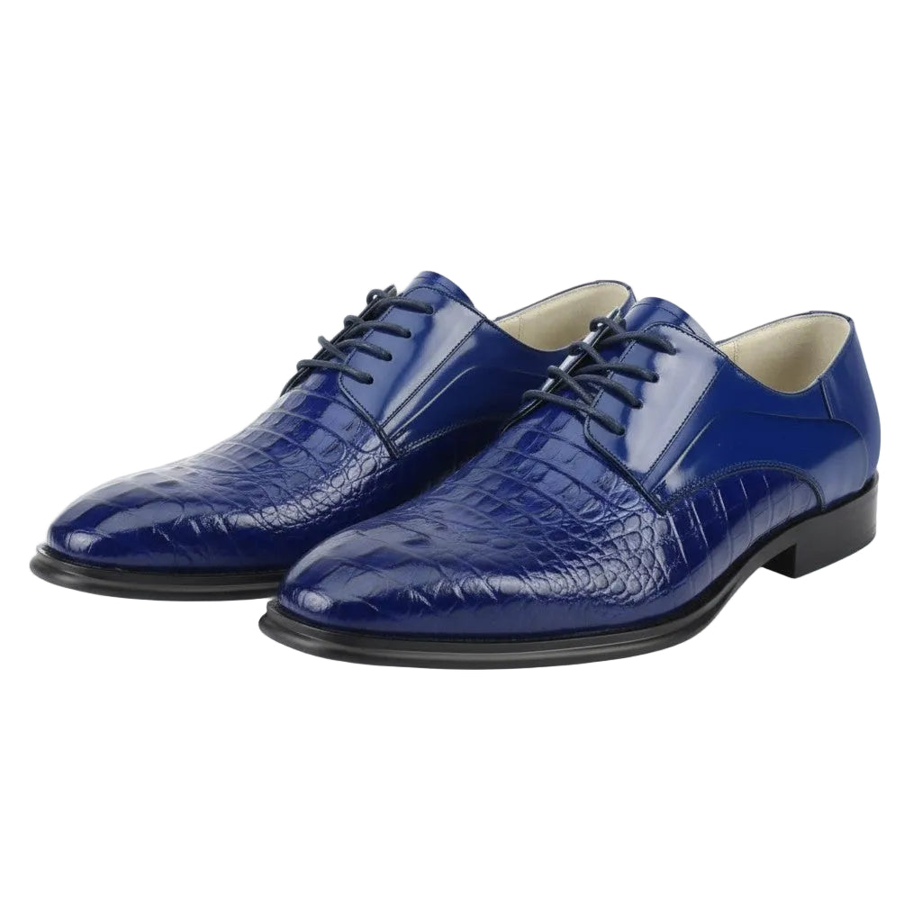 Pair of blue dress shoes with a textured pattern on a white background