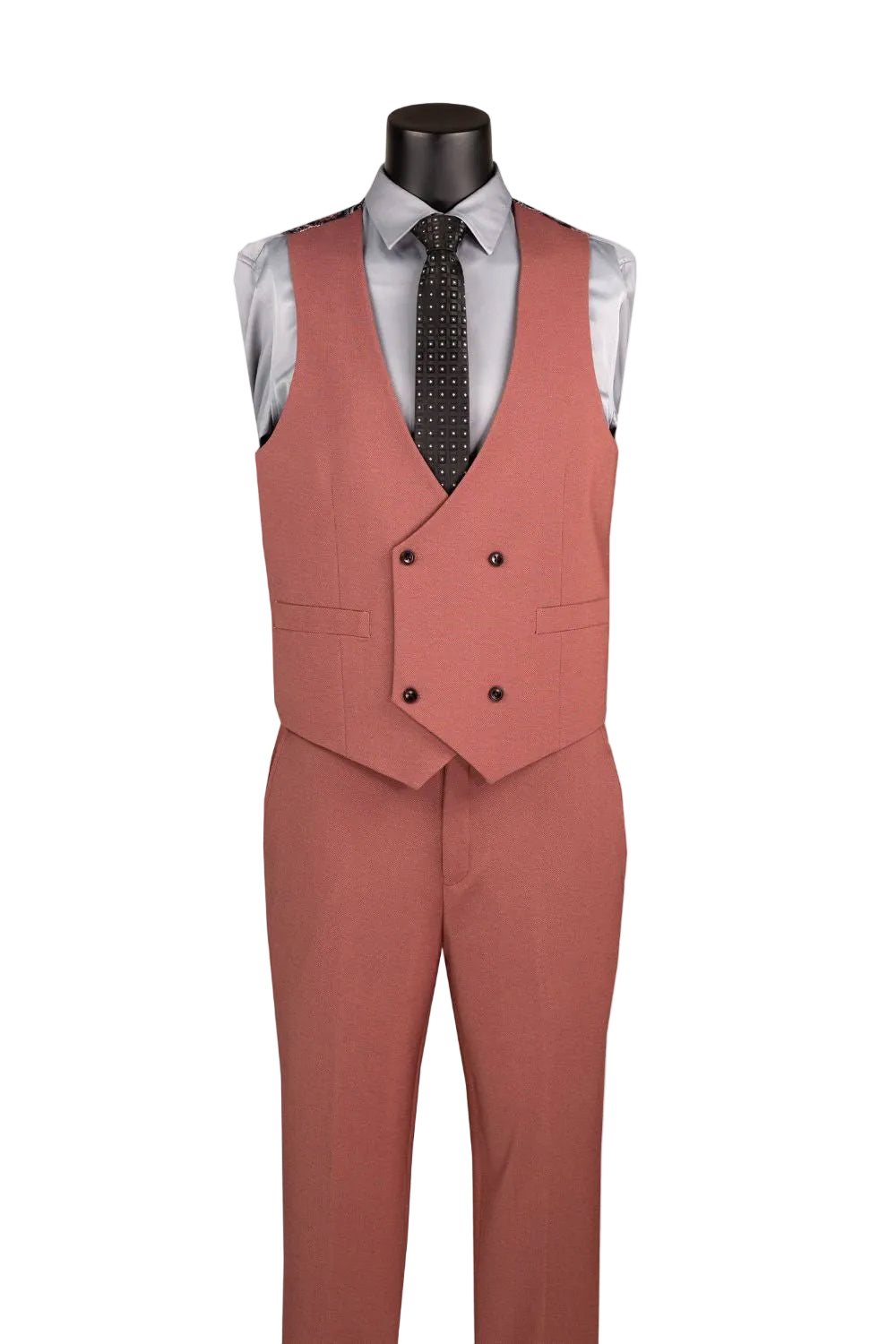 A men's three-piece suit displayed on a black mannequin torso, featuring a dusty rose double-breasted vest, matching trousers, a light gray dress shirt, and a dark patterned tie, set against a plain white background.
