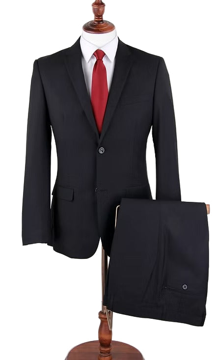 Black suit with a red tie on a mannequin against a white background