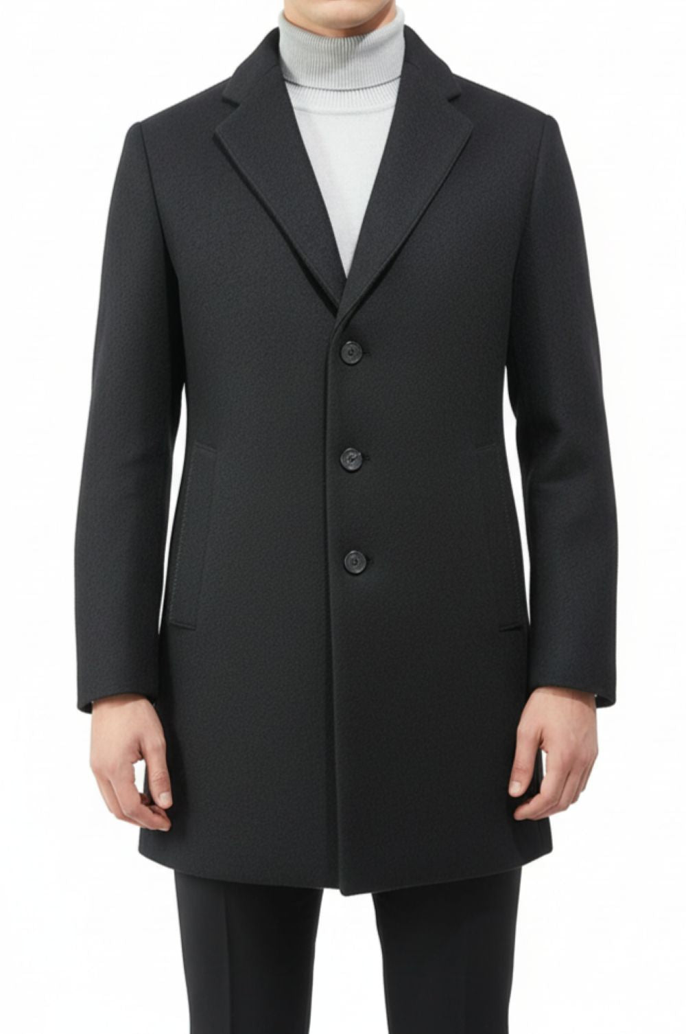 Black coat worn by a person on a white background