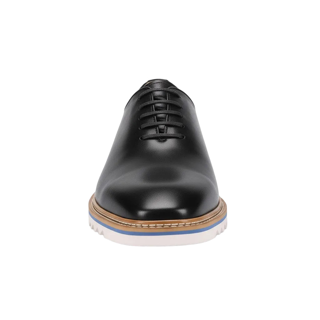 Charcoal leather dress shoe on a white background