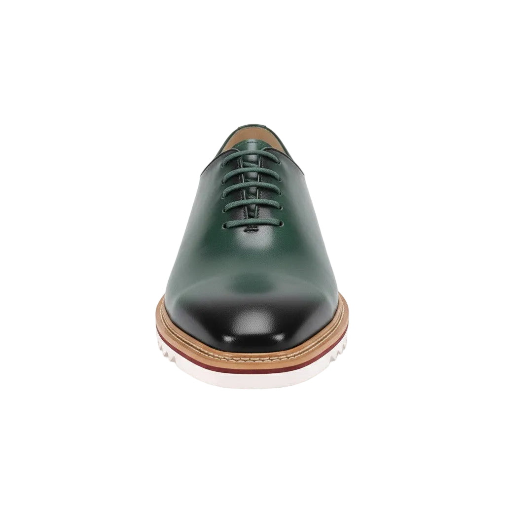 Green leather shoe on a white background