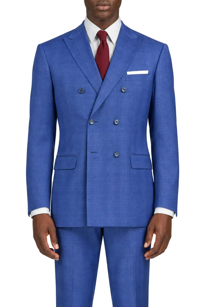 A man wearing a blue double-breasted suit with a white shirt and a red tie, shown from the neck down against a plain white background.