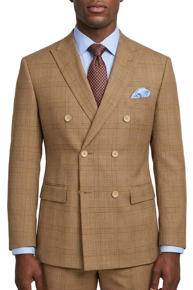 A man wearing a tan double-breasted suit with a subtle windowpane plaid pattern, styled with a light blue dress shirt, a brown patterned tie, and a light blue pocket square, against a plain light gray background.