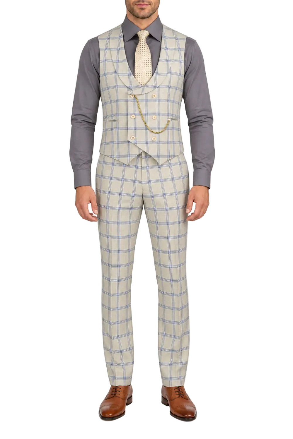 A man wearing a light beige and blue plaid three-piece suit with a waistcoat, a gray dress shirt, a cream tie, and brown leather dress shoes, shown against a plain white background.
