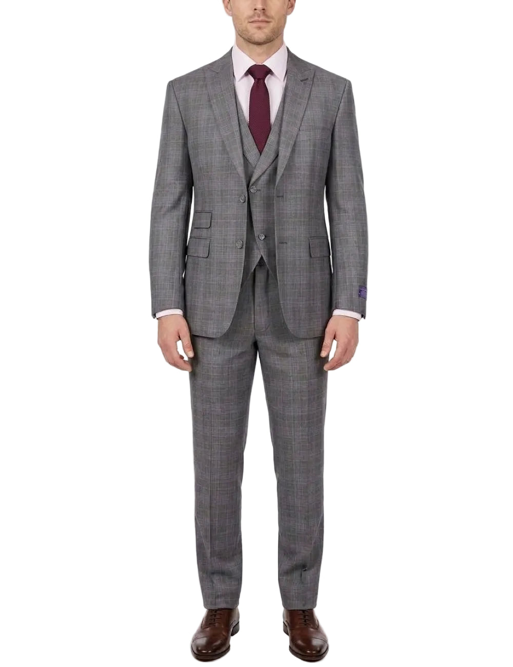 A man wearing a gray three-piece suit with a subtle windowpane pattern, paired with a white shirt, a dark burgundy tie, and brown leather dress shoes, standing against a plain white studio background.
