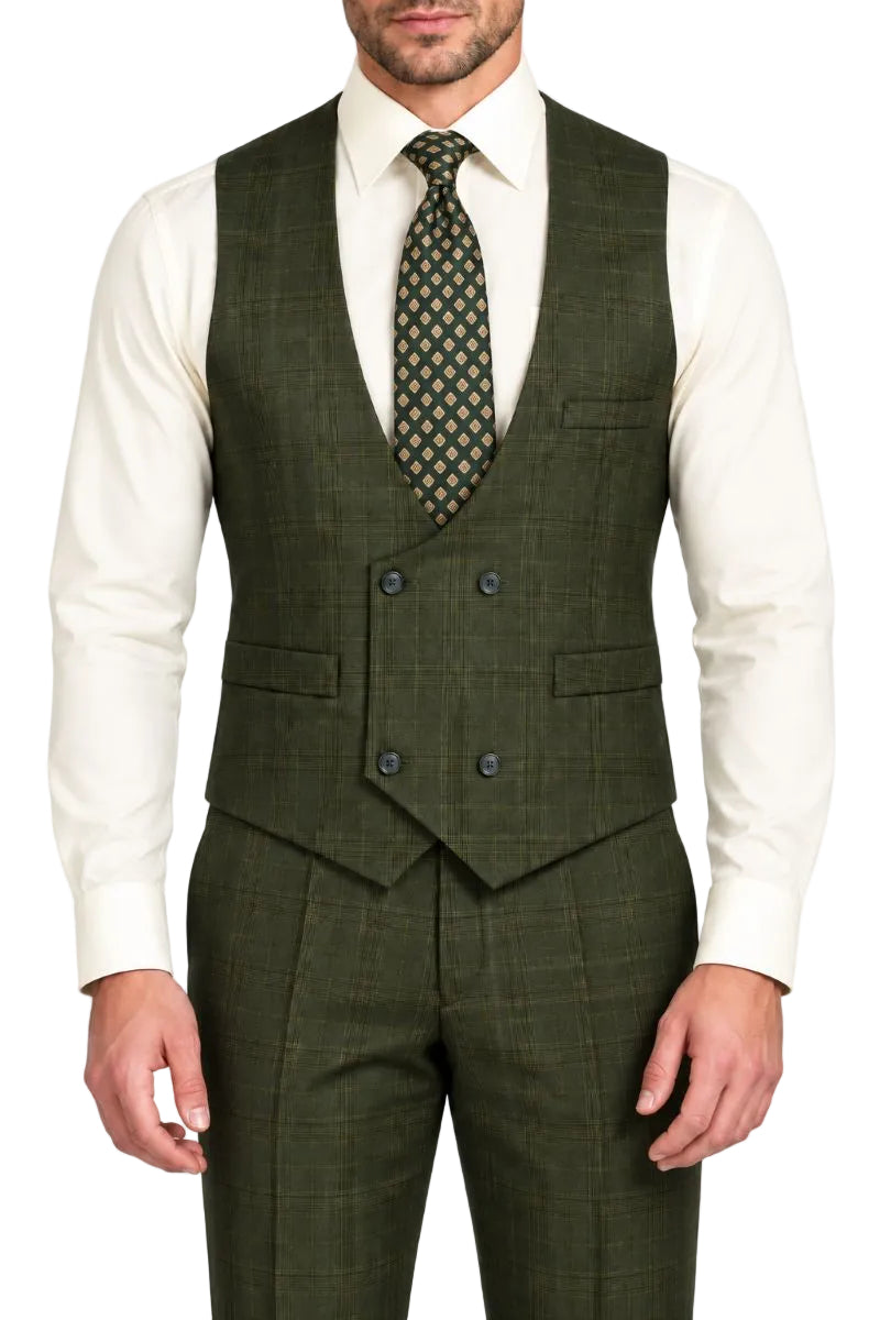 A man wearing a dark olive green three-piece suit with a subtle windowpane plaid pattern, featuring a double-breasted waistcoat, matching trousers, a white dress shirt, and a patterned tie.