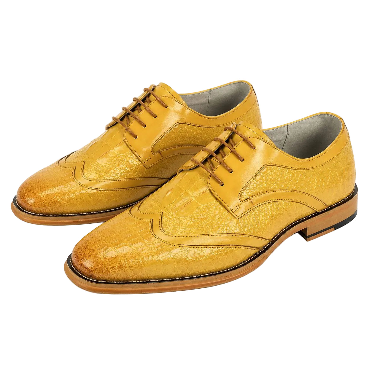 A pair of men's wingtip oxford shoes in textured mustard yellow leather, displayed on a clean white background.