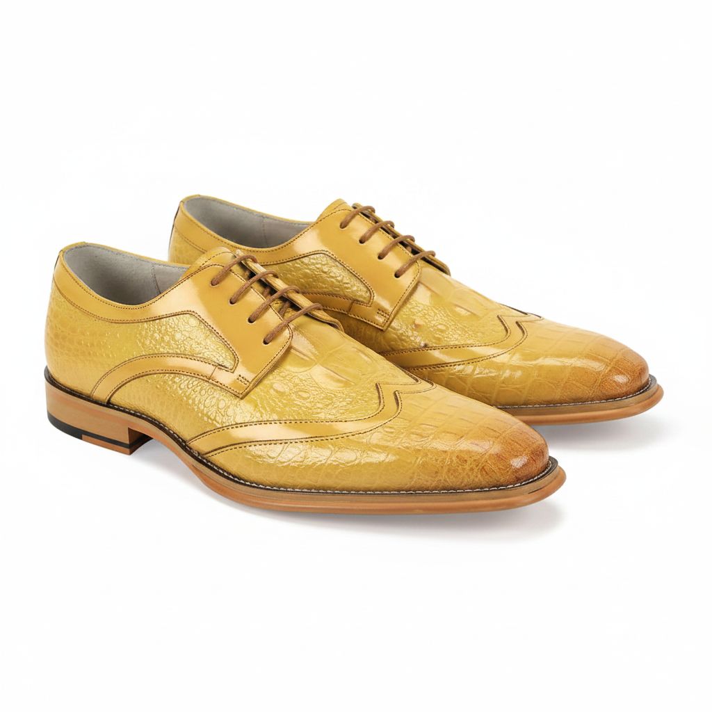 Pair of yellow leather dress shoes on a white background