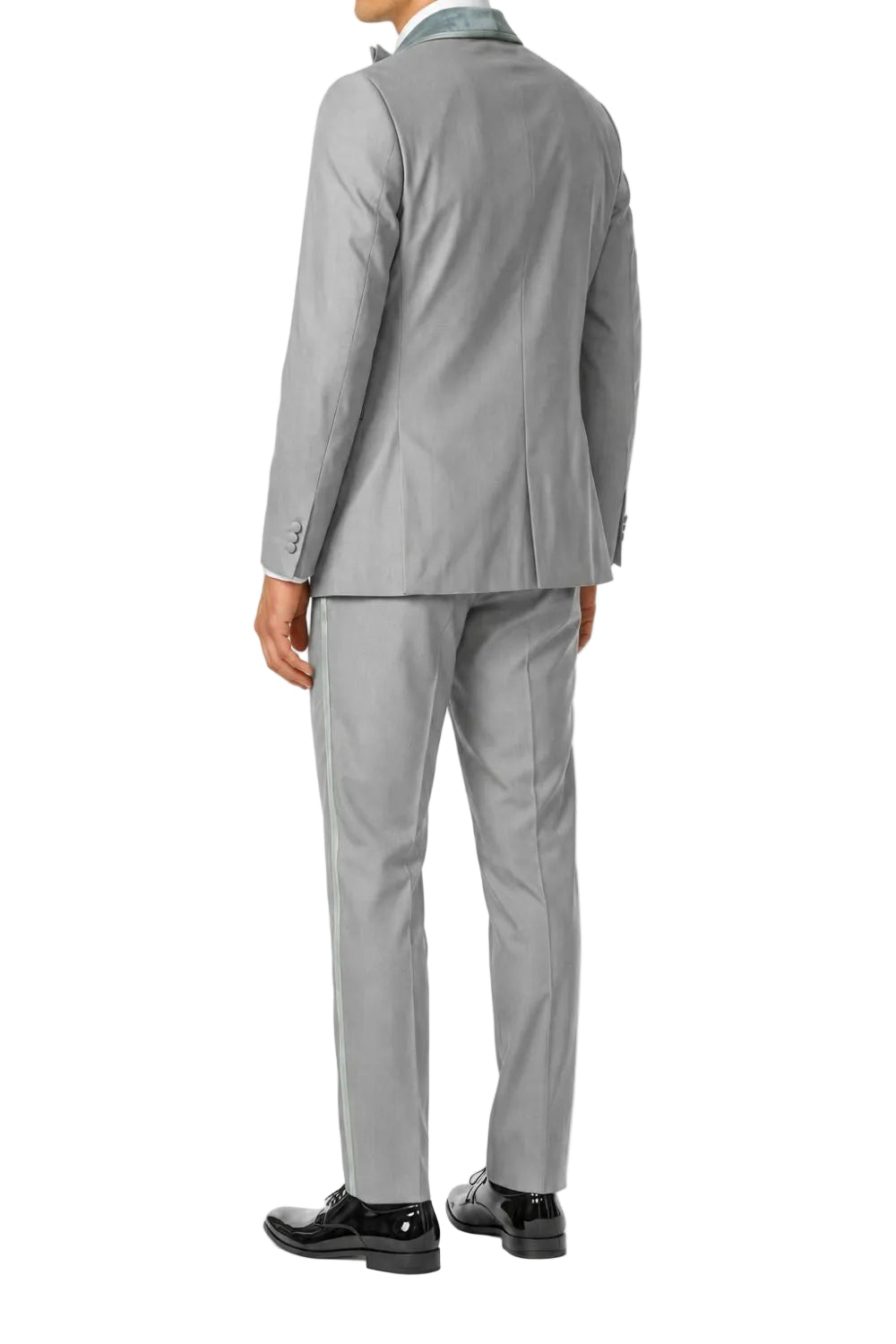 A man wearing a light gray two-piece suit, shown from the back, paired with a light blue dress shirt and black dress shoes, against a plain white background.
