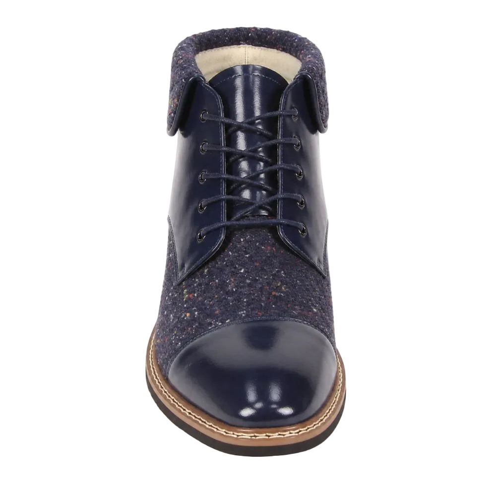 A navy blue lace-up ankle boot with a glossy patent leather toe cap, speckled tweed side panels, and a brown welted sole, shown from a front-facing perspective on a white background.