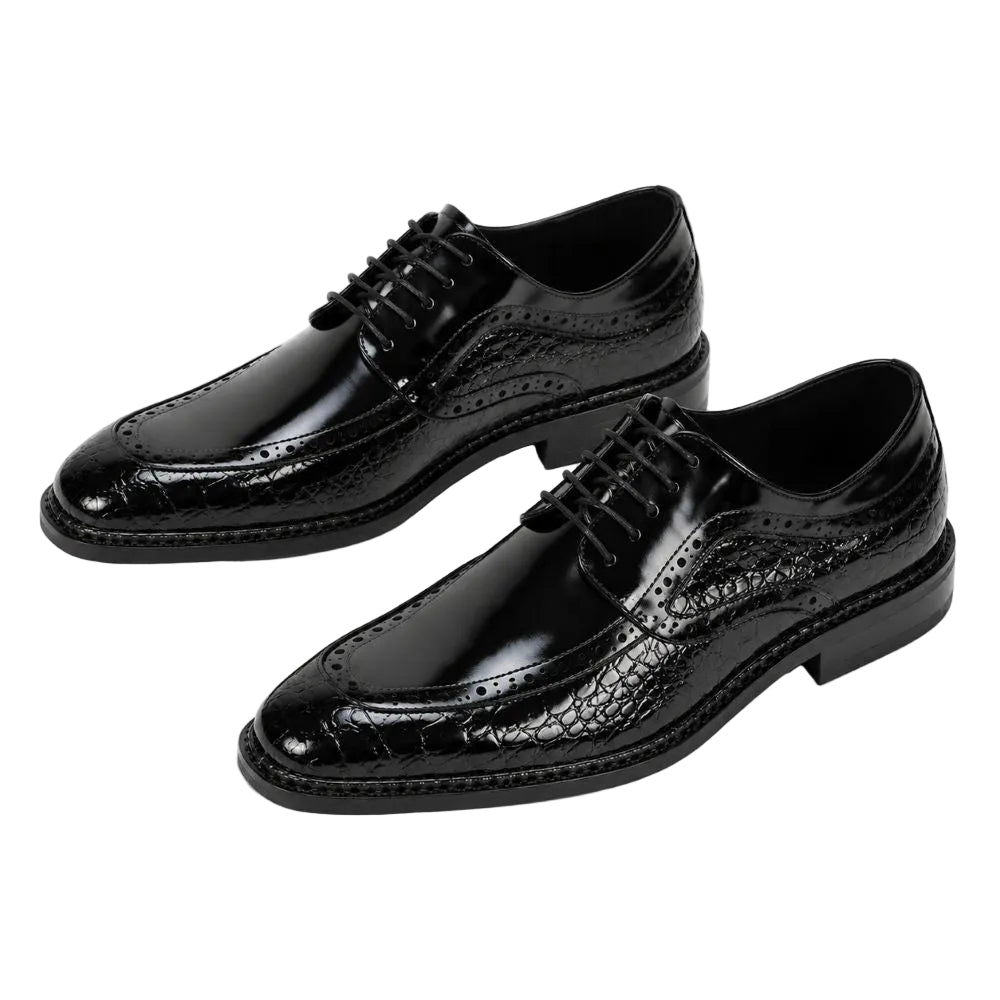 A pair of men's black leather oxford dress shoes with a glossy crocodile-embossed pattern on the toe and sides, featuring classic brogue detailing and black laces, set against a plain white background.