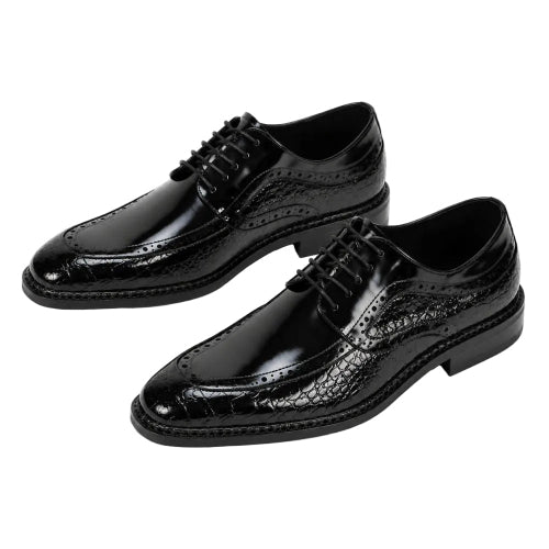 A pair of men's black leather oxford dress shoes with a glossy crocodile-embossed pattern on the toe and sides, featuring classic brogue detailing and black laces, set against a plain white background.