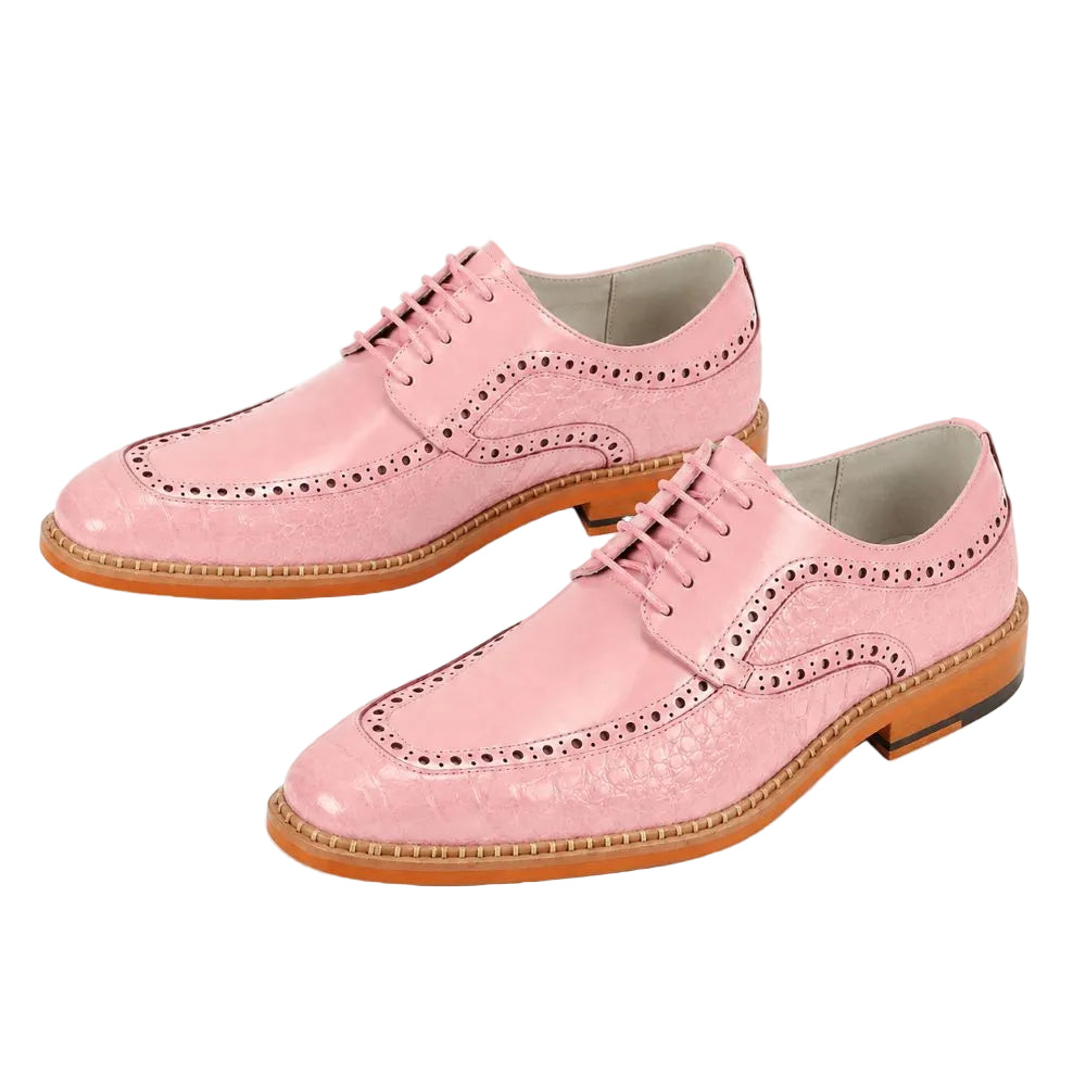 A pair of light pink leather wingtip oxford shoes with decorative brogue perforations and laces, displayed on a clean white background.