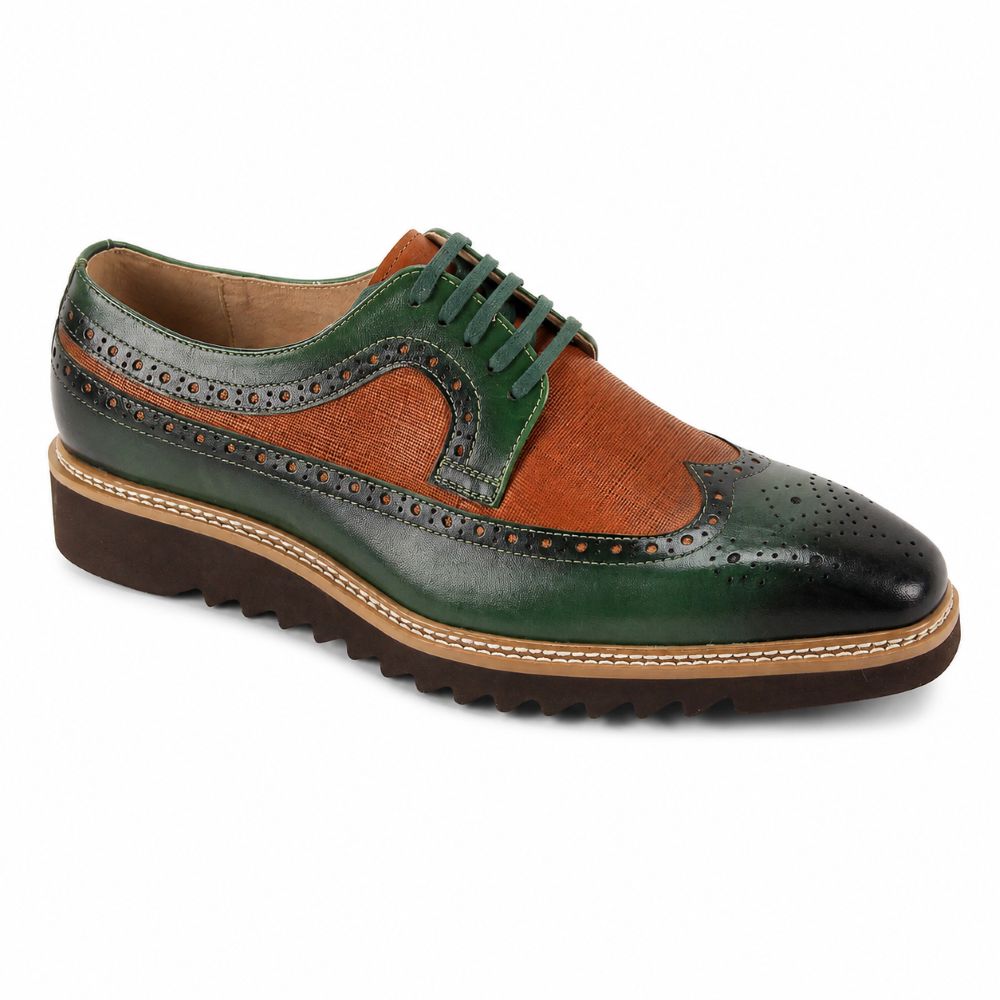 A men's wingtip oxford shoe featuring a dark green leather upper with a contrasting brown suede wingtip panel, dark green brogue detailing, and a brown lug sole.