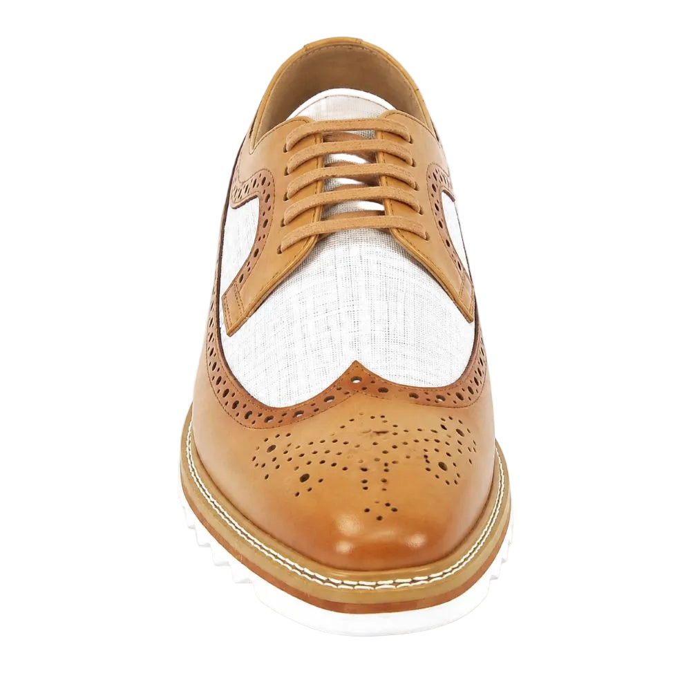 A single men's wingtip oxford shoe shown from a front-facing top-down perspective. The upper is made of tan leather with a contrasting white woven panel on the vamp, matching tan laces, and a white sole.