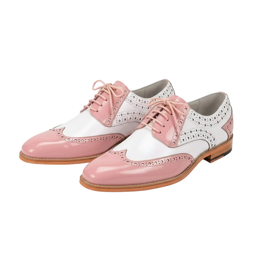 Pink and white shoes with brown soles on a white background