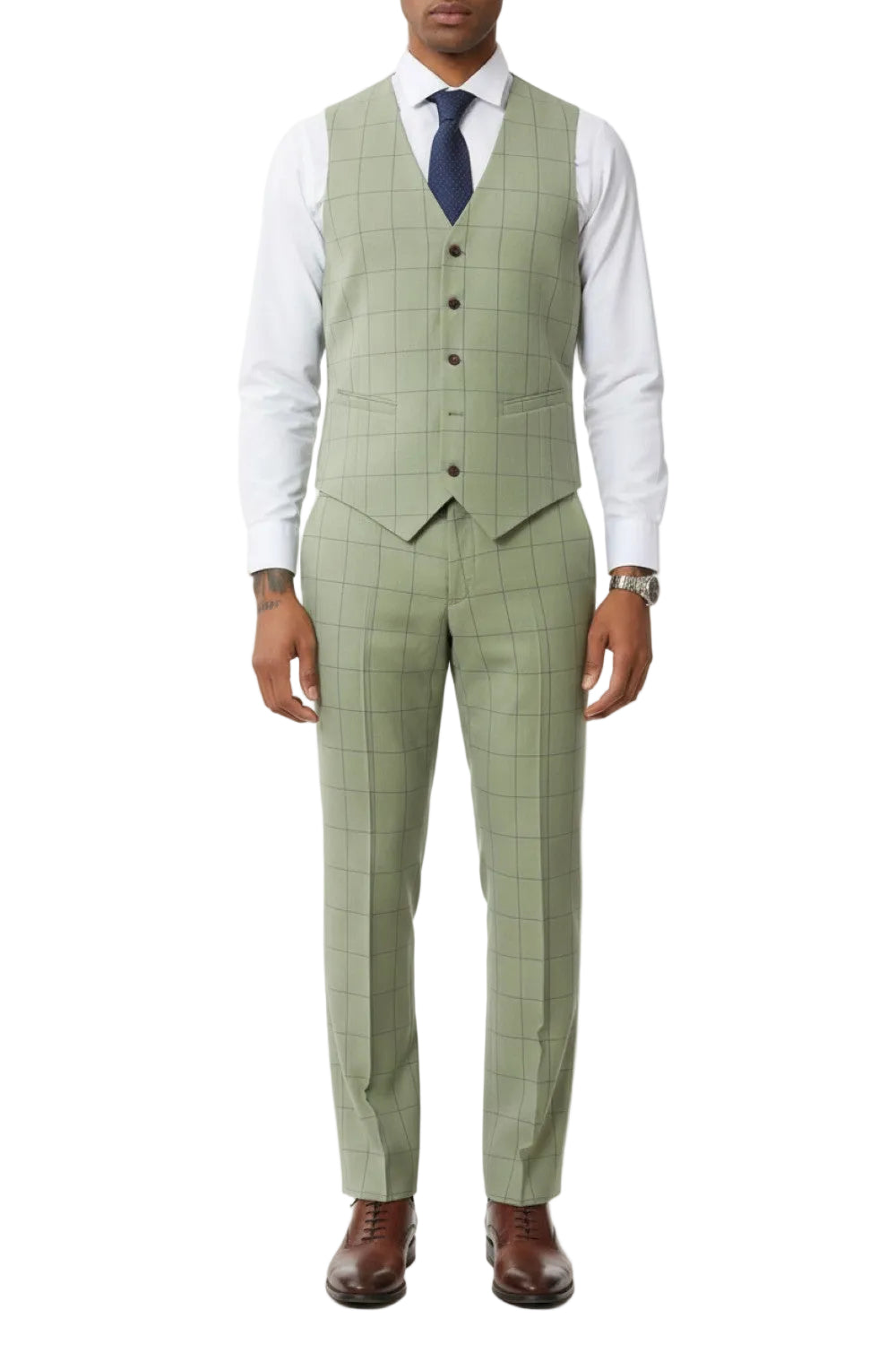 Man wearing a green checkered suit with a white shirt and brown shoes on a white background