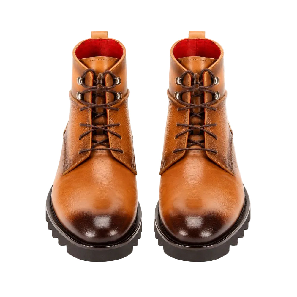 A pair of men's brown leather lace-up boots with dark brown rubber soles and a bright red interior lining, shown from a front-facing perspective on a white background.
