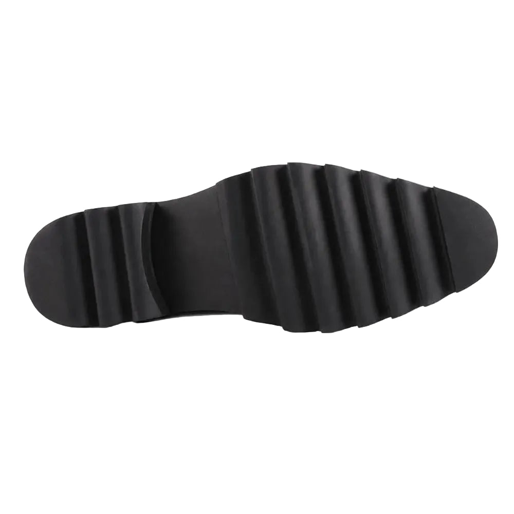 A close-up view of a black rubber shoe sole with a ribbed, wavy tread pattern, shown against a plain white background.