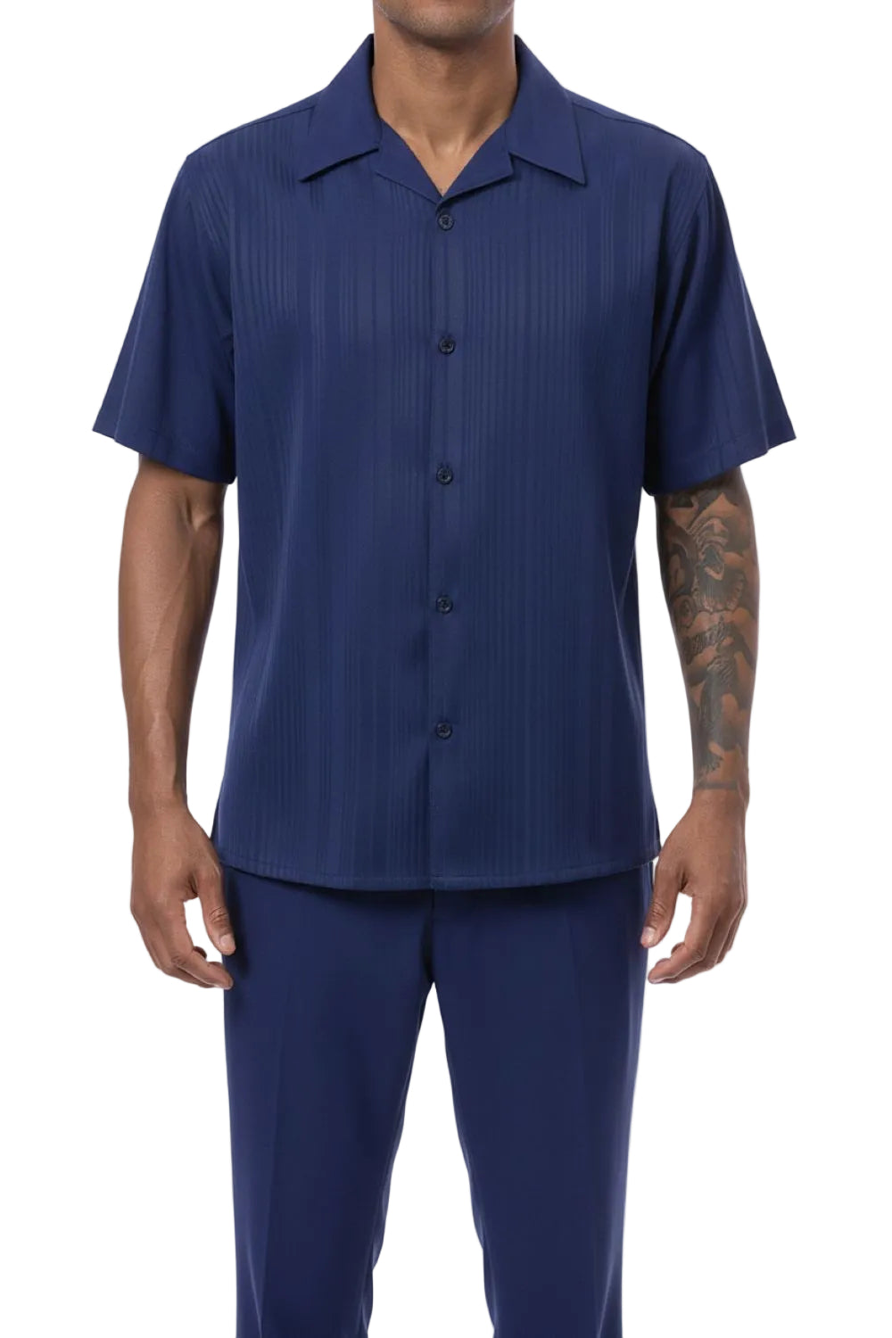 Man wearing a navy blue button-up shirt and pants on a white background
