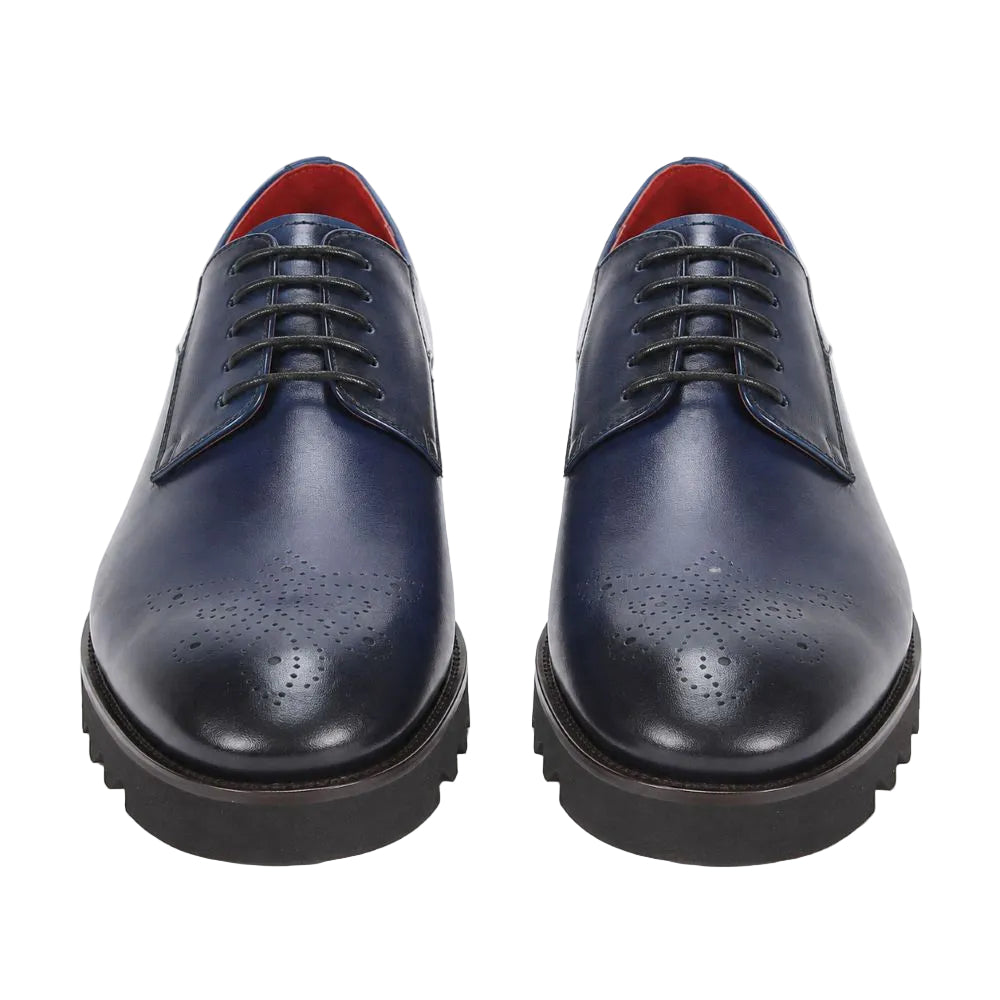 A pair of men's navy blue leather oxford shoes with brogue detailing, black laces, and chunky black soles, shown from a front-facing perspective on a white background.