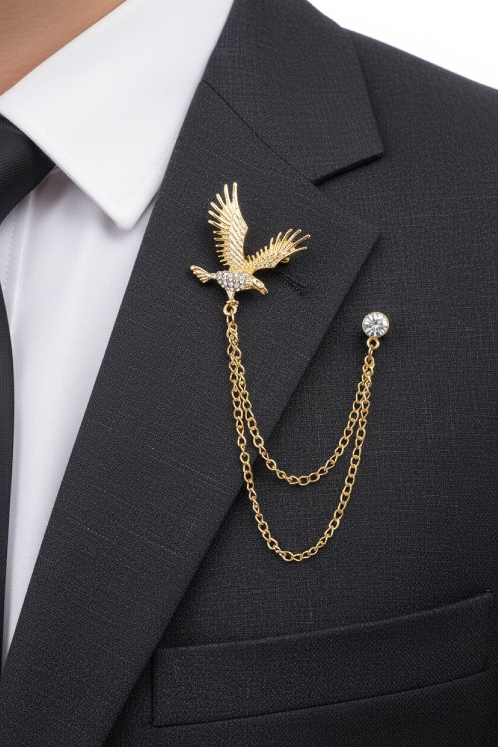 Gold eagle brooch with chain on a black suit jacket