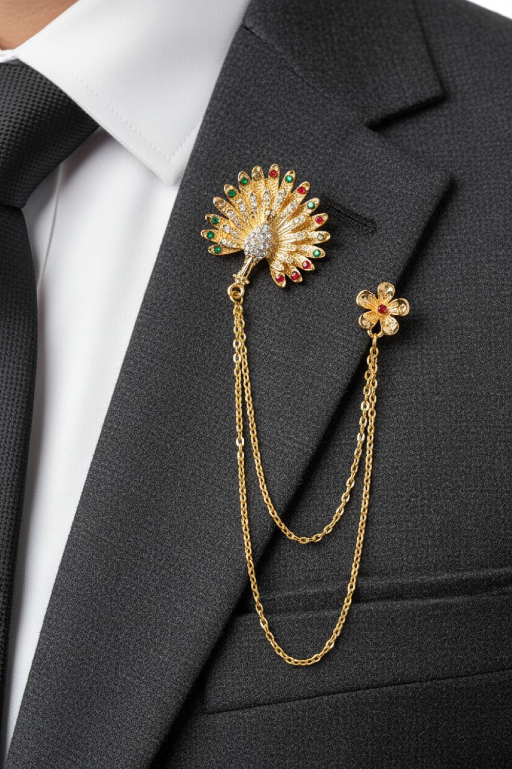 Gold brooch with chain on a suit jacket