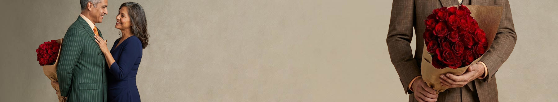 Two people holding bouquets of red flowers against a neutral background